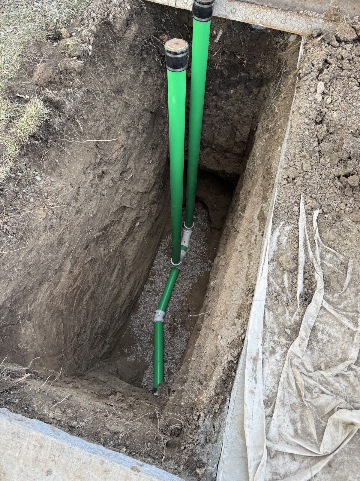 Sewer line replacement trench with new cleanouts in Utah County