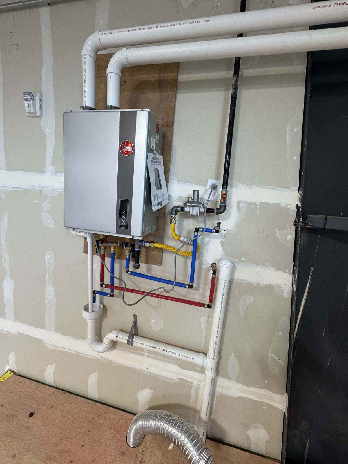Wall-mounted tankless water heater installed by Utah Service Pros in Utah County