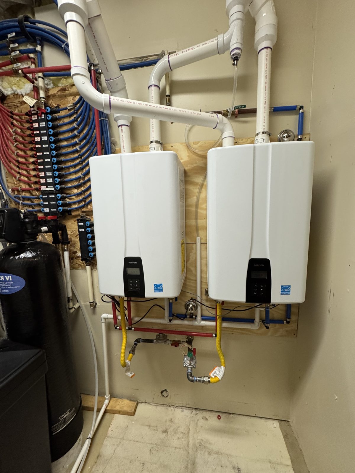 Two tankless water heaters paired with a water softener system