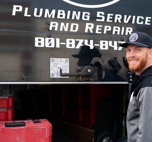Utah Service Pros plumber at the branded service truck in Payson, Utah