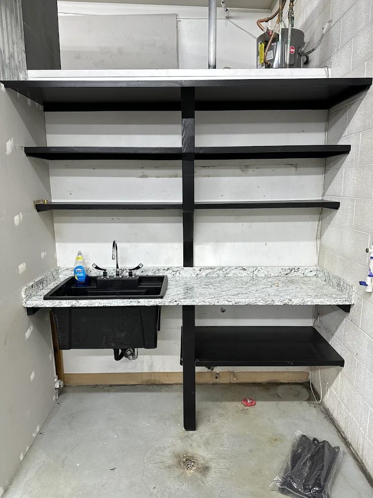 Garage utility sink and faucet installation with countertop