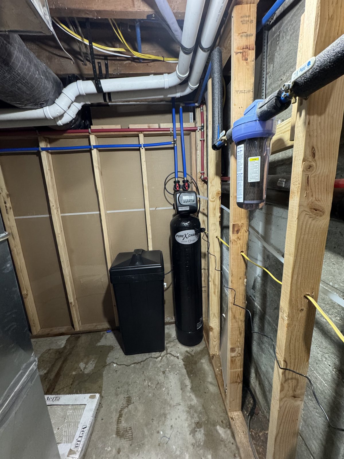Water softener resin and brine tanks installed in a Utah County basement